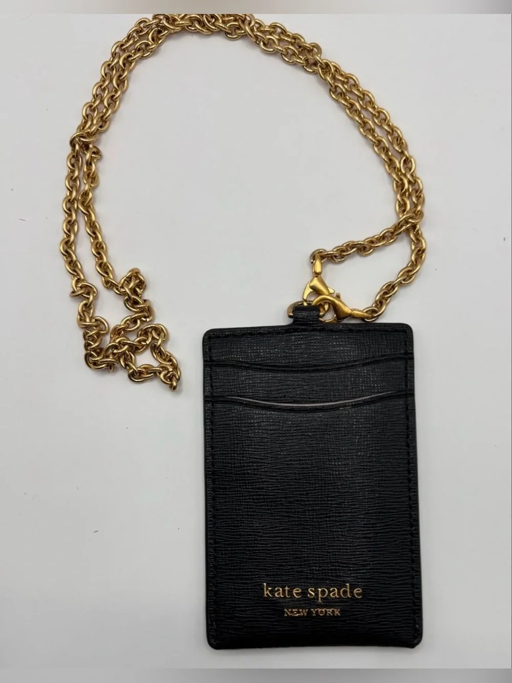 Kate Spade lanyard is holder black gold chain